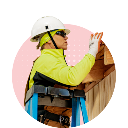 Construction Program Area: image of a woman hammering a nail into a wooden structure.